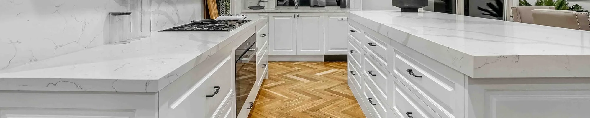 White cabinet kitchen with hardwood flooring