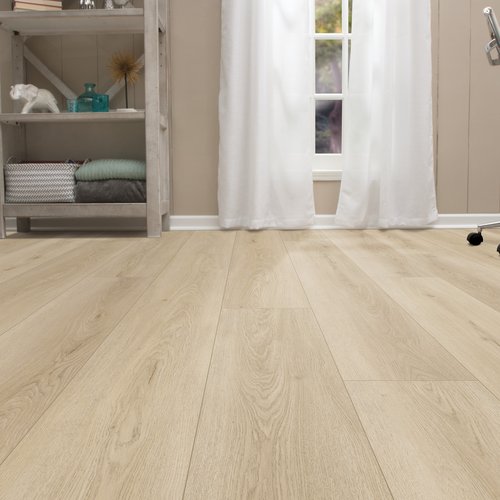 Light wood luxury vinyl tile (LVT) flooring in a modern home office with a bookshelf and office chair.